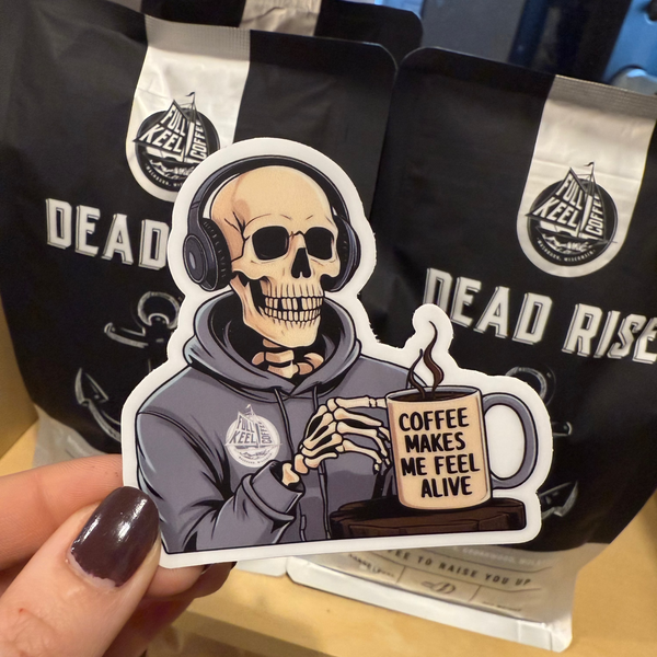 Full Keel Coffee sticker featuring a skeleton holding a coffee cup with the phrase “Coffee Makes Me Feel Alive” – funny caffeine-themed vinyl decal for coffee lovers.